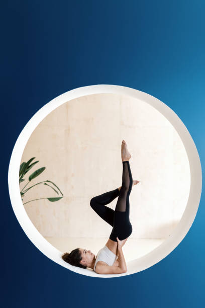 istock Sporty woman training alone in yoga class 1303653017