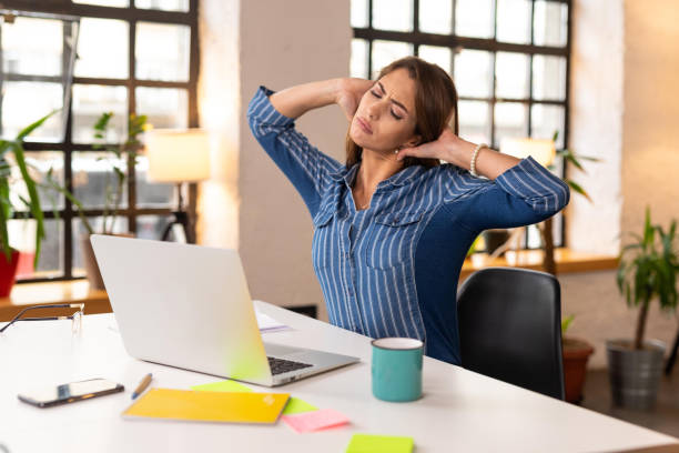 istock Young businesswoman suffering from neckache 1303653147