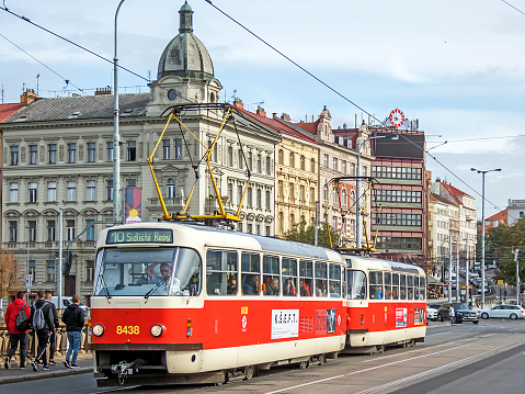 Prague, Czech Republic - October 04, 2019: Tram and pedestrians on the Palackeho bridge in Prague.