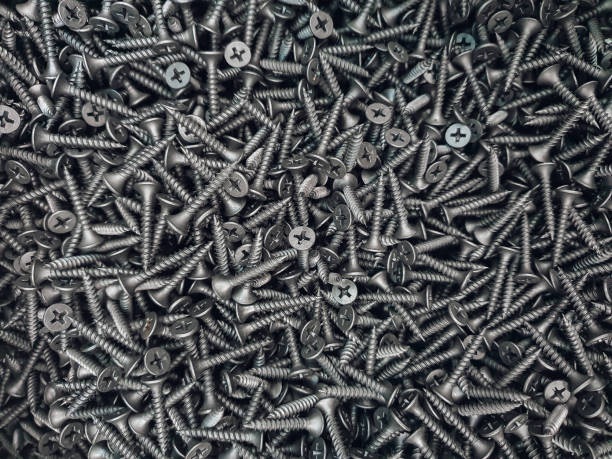 istock Screws. Black steel  screws for background. 1303657207