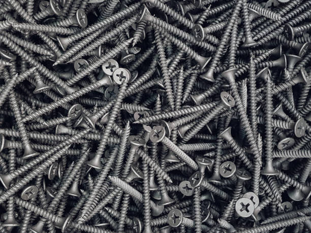 istock Screws. Black steel  screws for background. 1303657229