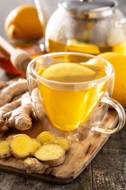 istock Ginger tea with lemon and honey in crystal glass 1303657303