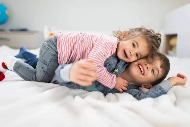 Photo of Playful brother and sister