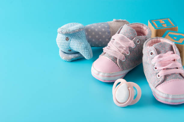 istock Baby rompers, shoes, feeding bottle, pacifier and toy 1303657506