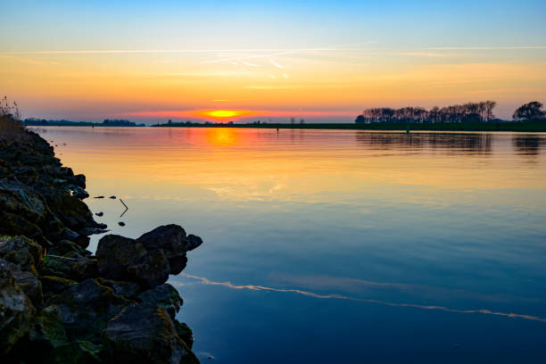 Sunset at the river IJssel during early spring in Overijssel, The Netherlands.