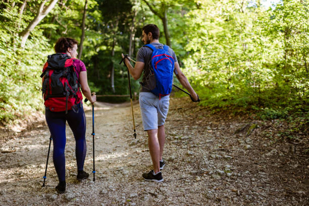 istock Young couple climbing the mountain 1303659857