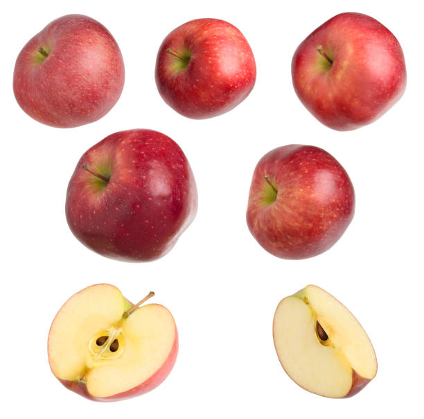 istock Red delicious apples isolated with cuts on white background. 1303659896