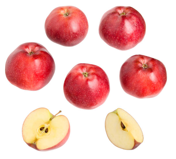 istock Red delicious apples isolated with cuts slices on white background. 1303659899
