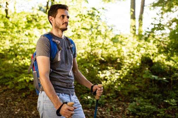 istock Young man climbing the mountain 1303659901