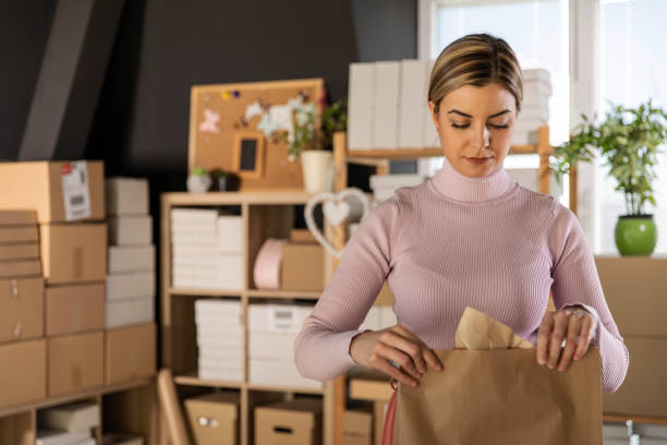 istock Female business owner making a sustainable care package 1303661347