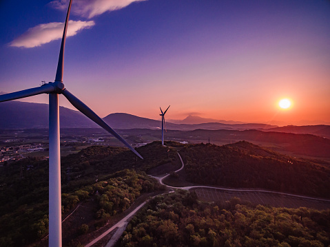 Wind Turbines Windmill Energy Farm at sunset in Italy, aerial view