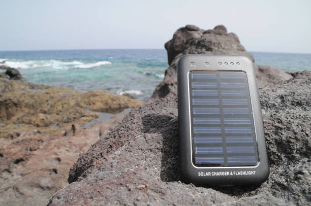 Solar Panel - energy on the beach Portable Small Solar Panel near the Atlantic Ocean contoy island stock pictures, royalty-free photos & images