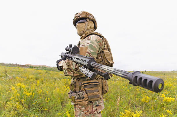 istock Equipped and armed special forces soldier in the field 1303666563