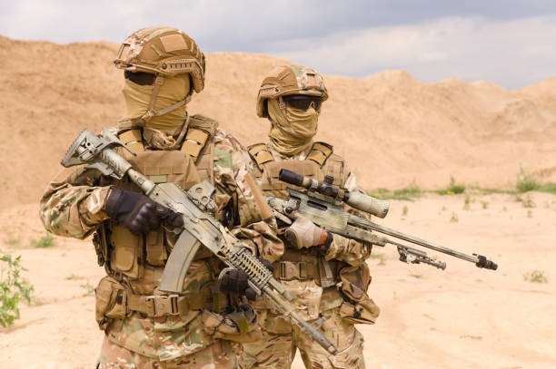 istock Equipped and armed special forces soldiers 1303666629