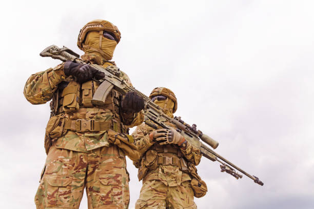 istock Armed special forces soldiers close up 1303666665