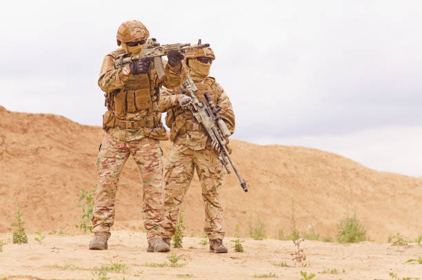 istock Two special forces snipers in the desert. 1303666668