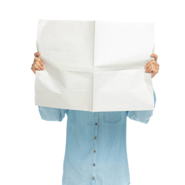 istock casual woman covering her face with a newspaper 1303668708