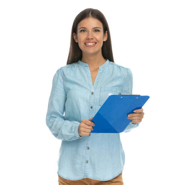 istock casual woman reading her notes from the clipboard 1303670117