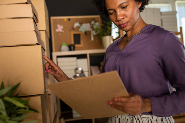 istock Businesswoman checking labels on packages 1303670698