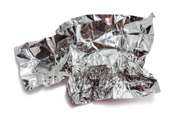 istock White shiny aluminum foil wrap on a white background. 1303671685