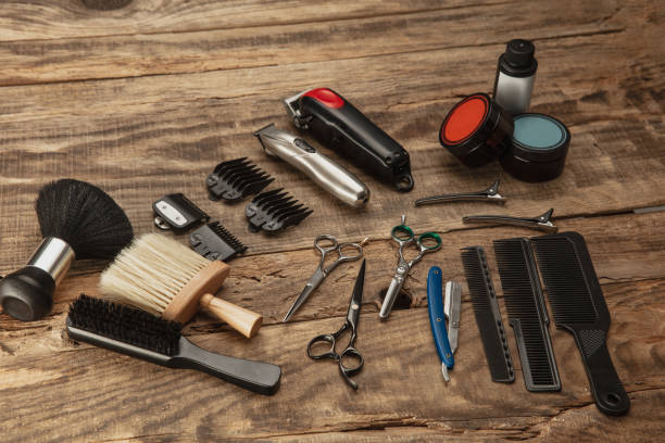 istock Barber shop equipment set isolated on wooden table background. 1303673145
