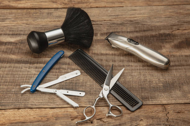 istock Barber shop equipment set isolated on wooden table background. 1303673157