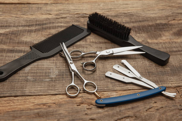 istock Barber shop equipment set isolated on wooden table background. 1303673159