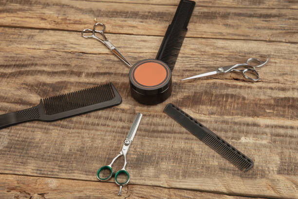istock Barber shop equipment set isolated on wooden table background. 1303673202