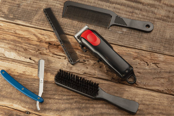 istock Barber shop equipment set isolated on wooden table background. 1303673232