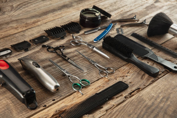 istock Barber shop equipment set isolated on wooden table background. 1303673270