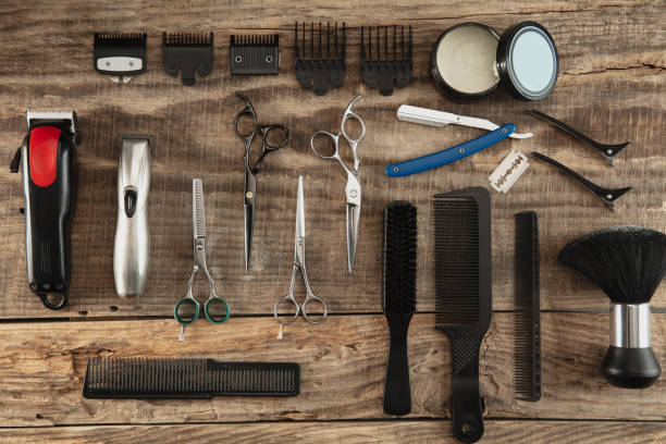 istock Barber shop equipment set isolated on wooden table background. 1303673280