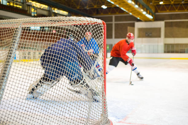 istock Hockey players playing ice hockey 1303673741