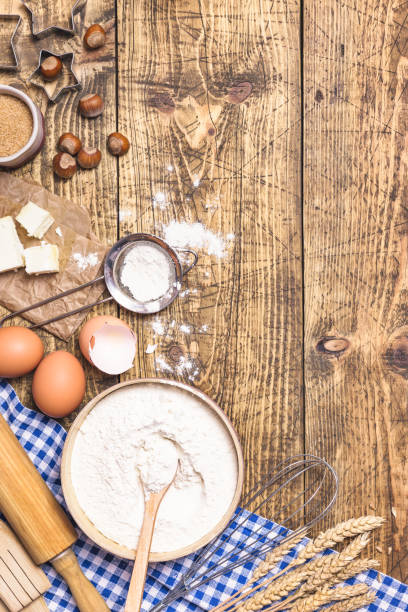 istock Baking and cooking ingredients on rustic wooden background 1303674287