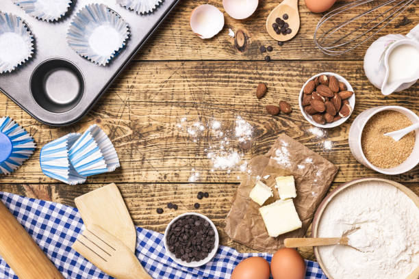 istock Baking and cooking ingredients on rustic wooden background 1303674294
