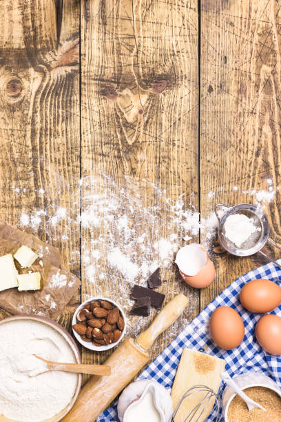 istock Baking and cooking ingredients on rustic wooden background 1303674321