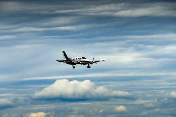 Everett, Washington State, USA - June 2018: Cessna 340 twin engined light aircraft (registration N700DK) with wheels and flaps down coming into land at Everett.