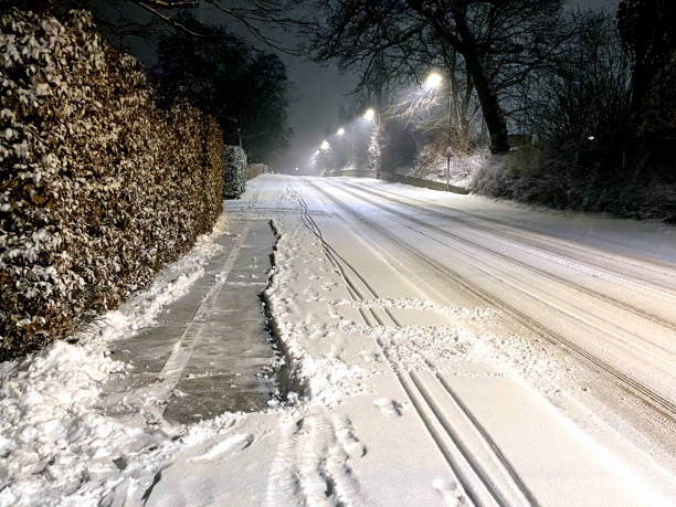 Pavement cleared of snow in residential district.