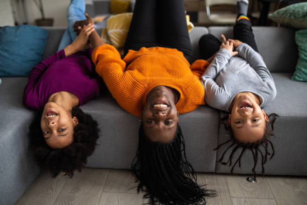 istock Happy young family having fun time together at home 1303676833