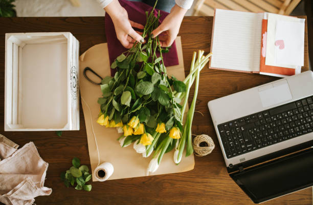 Top view of a woman making a bouquet