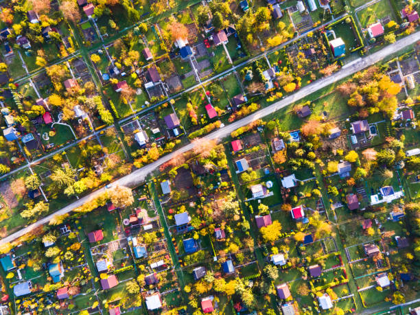 istock Abstract Pattern of Plot Gardens in Urban Area. Colorful Foliage in Autumn. Top Down Drone View 1303678146