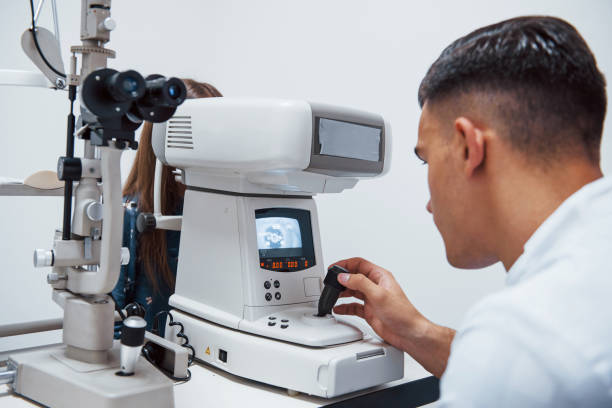 istock Oculist tests vision of patient by using special modern machine 1303678149