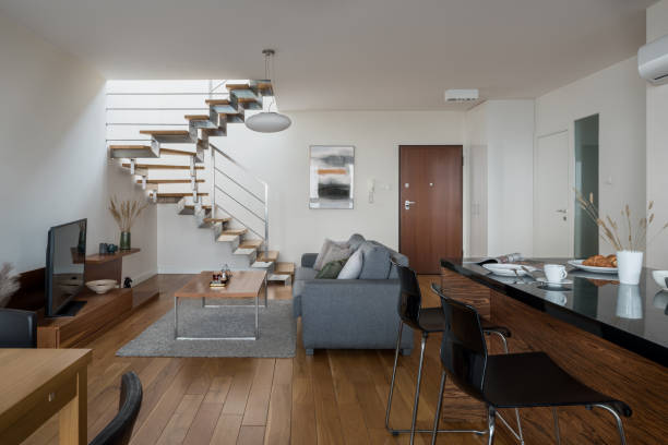 istock Small two-story apartment with wood decor 1303678294