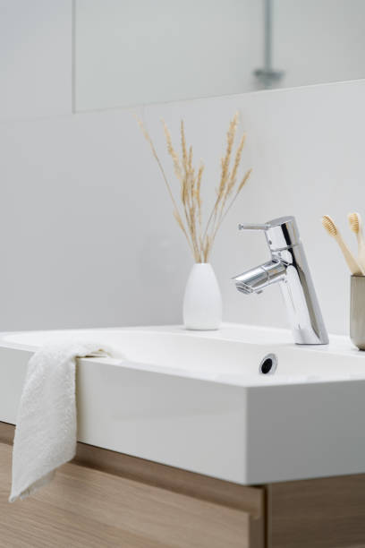 istock Close-up on simple bathroom washbasin 1303678301