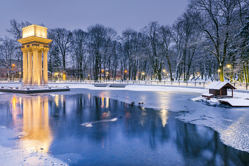 Historical Monument Illuminated at Twilight in Park Strzelecki,Tarnow,Poland. Winter in the City.