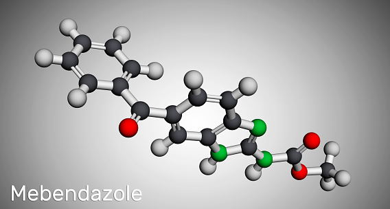 Mebendazole, MBZ molecule. It is synthetic benzimidazole derivate and anthelmintic drug. Molecular model. 3D rendering. 3D illustration