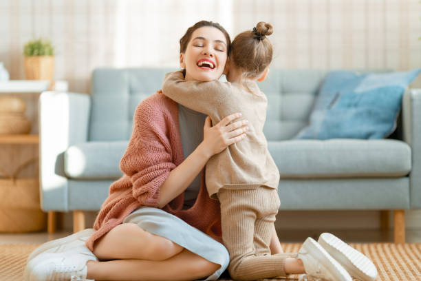 istock Mom and her daughter smiling and hugging 1303682976