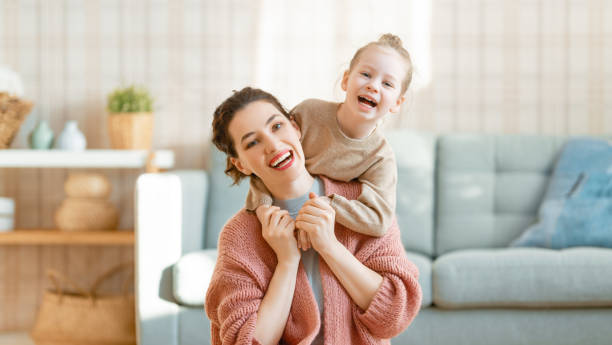 istock Mom and her daughter smiling and hugging 1303683039
