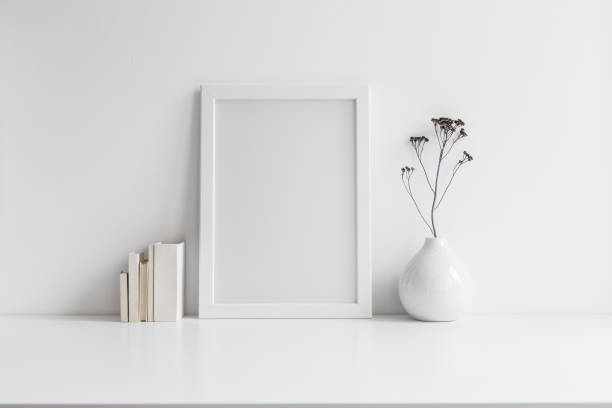 istock Picture frame and vase with decorative plant. Mock up. 1303683171