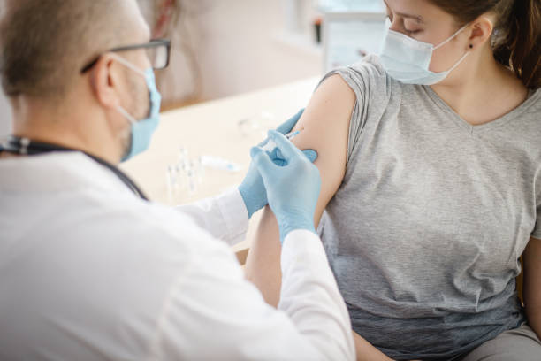 istock doctor and patient in a medical office 1303683285