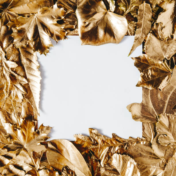 istock White card note with frame of golden leaves 1303685610